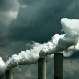 A coal-fired power plant emits carbon dioxide (a greenhouse gas) and numerous pollutants into the air.