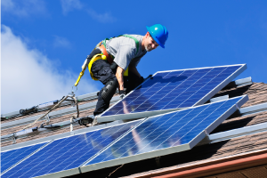 Installing solar panels on a residential rooftop